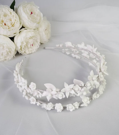 Bridal double headband with porcelain flowers and leaves, handmade by Glo&Sons. Romantic and elegant design for brides
